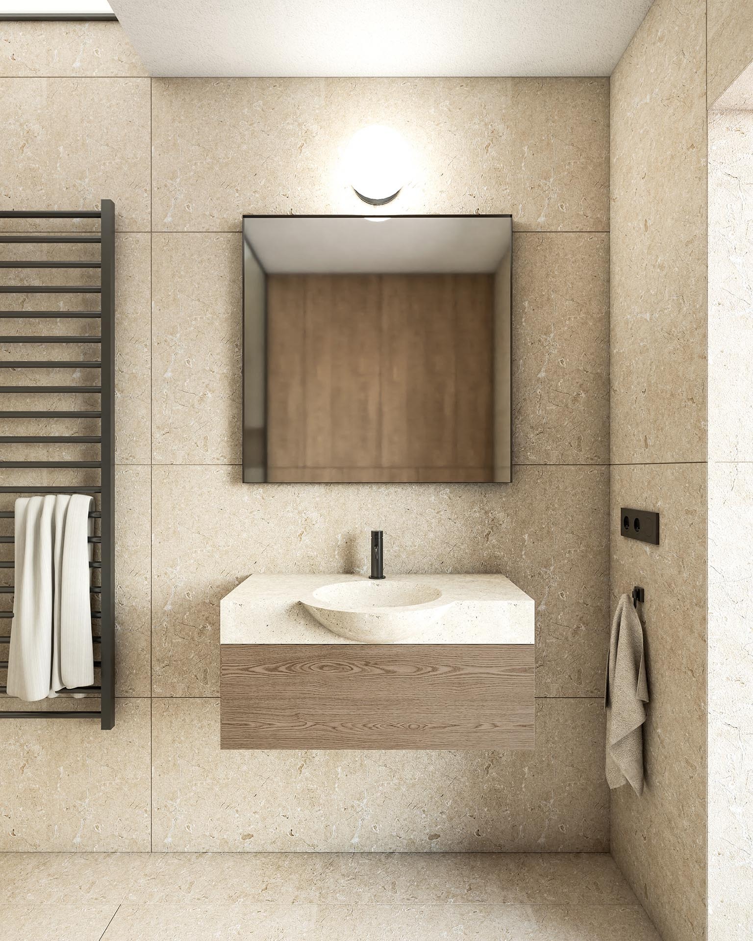 Beżowa łazienka z umywalką nablatową z kamienia, lustrem w czarnej ramie, grzejnikiem drabinkowym z białym ręcznikiem i szarym ręcznikiem wiszącym na haczyku.