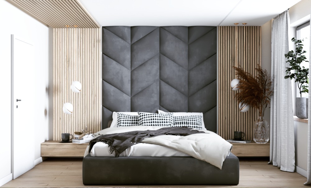 Nowoczesna sypialnia z łóżkiem kontynentalnym, tapicerowanym zagłówkiem w geometryczny wzór, drewnianymi lamelami na ścianie i wiszącymi lampami kulami.