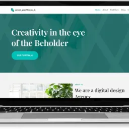 Laptop wyświetlający stronę internetową z nagłówkiem 'Creativity in the eye of the Beholder' i przyciskiem 'Our Portfolio', z sekcją 'About Us' poniżej, przedstawiającą firmę jako agencję digital...