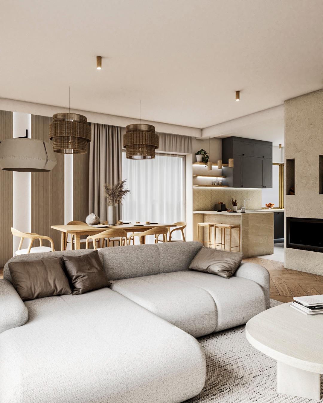 Jasne wnętrze z sofą narożną, drewnianym stołem jadalnym i otwartą kuchnią. Wystrój w neutralnych barwach z akcentami naturalnych materiałów i tekstylnych lamp.