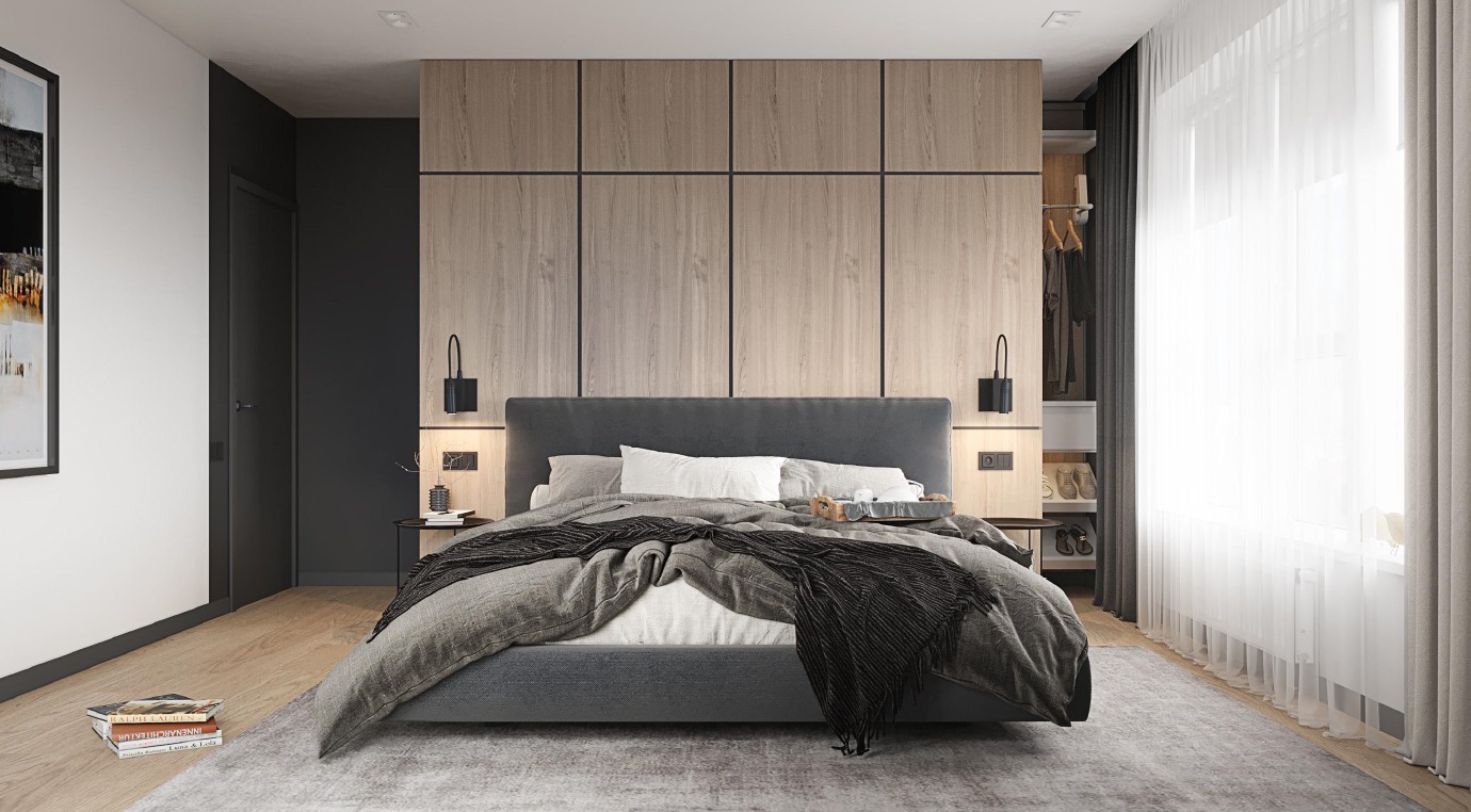 Nowoczesna sypialnia w stonowanych kolorach: szare łóżko z narzutą, drewniana zabudowa ściany za wezgłowiem, minimalistyczne lampki nocne i subtelne oświetlenie punktowe.