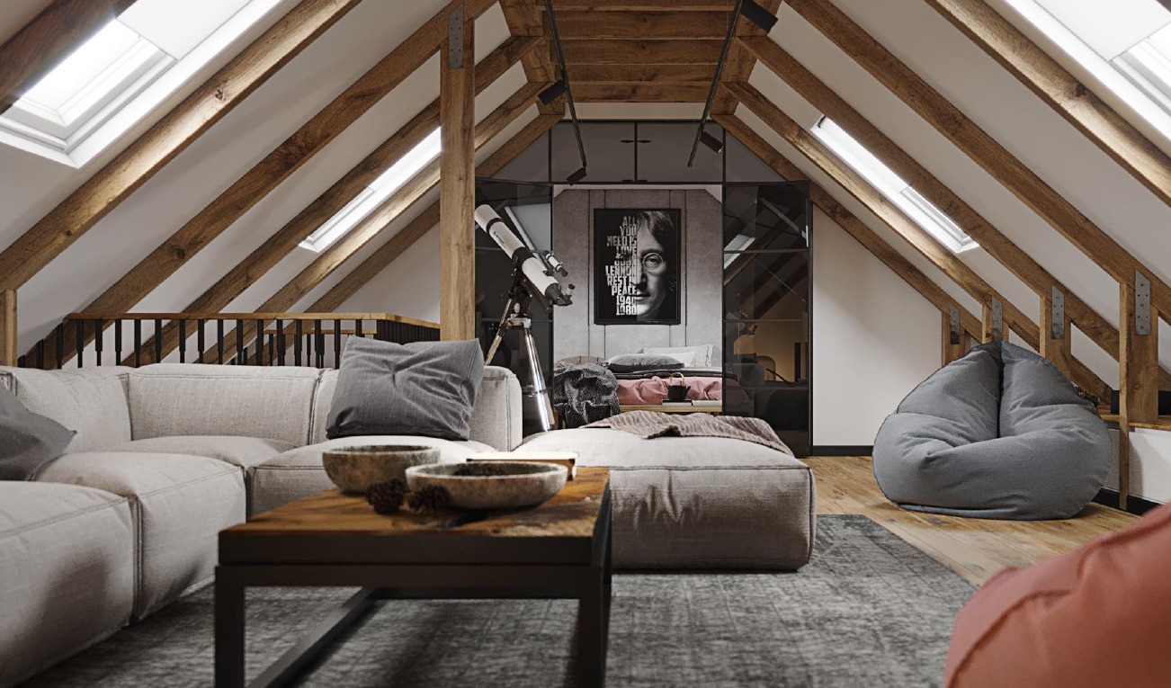 Jasne poddasze z drewnianą konstrukcją dachu, szarą sofą modułową, teleskopem i portretem Johna Lennona w ramie.