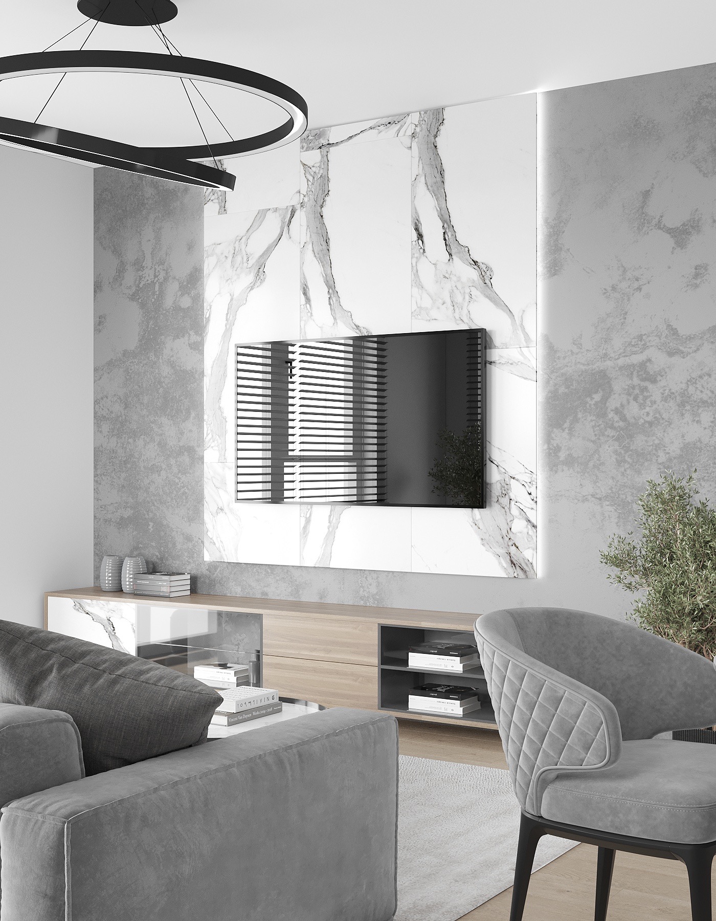 Nowoczesny salon z szarą sofą, fotel z pikowanym oparciem, telewizor na marmurowej ścianie, i okrągła lampa sufitowa.