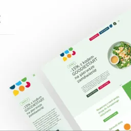 Projekt strony internetowej Goodie Foodie z promocją -15% z kodem GOODIESTART na pierwsze zamówienie. Widoczne zdjęcia dań i menu dietetyczne.
