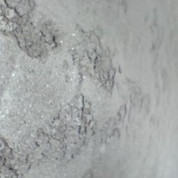 Grudziądz - Szare, nierównomierne tło z widocznymi drobnymi plamkami i teksturą przypominającą niedokładne wykończenie ściany lub sufitu.