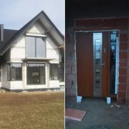 Dom jednorodzinny w trakcie budowy z zamontowanymi oknami i roletami zewnętrznymi, oraz zamontowane drzwi wejściowe z brązowego drewna i elementami ze stali nierdzewnej, a w tle budynek...