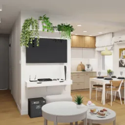 Wizualizacja salonu w mieszkaniu z aneksem kuchennym; telewizor otoczony roślinami, białe meble, drewniana podłoga, wzmacniacz gitarowy Peavey.