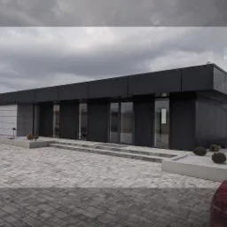 Nowoczesny, parterowy budynek z czarną elewacją panelową i szarymi elementami, otoczony kostką brukową i niską roślinnością ozdobną.