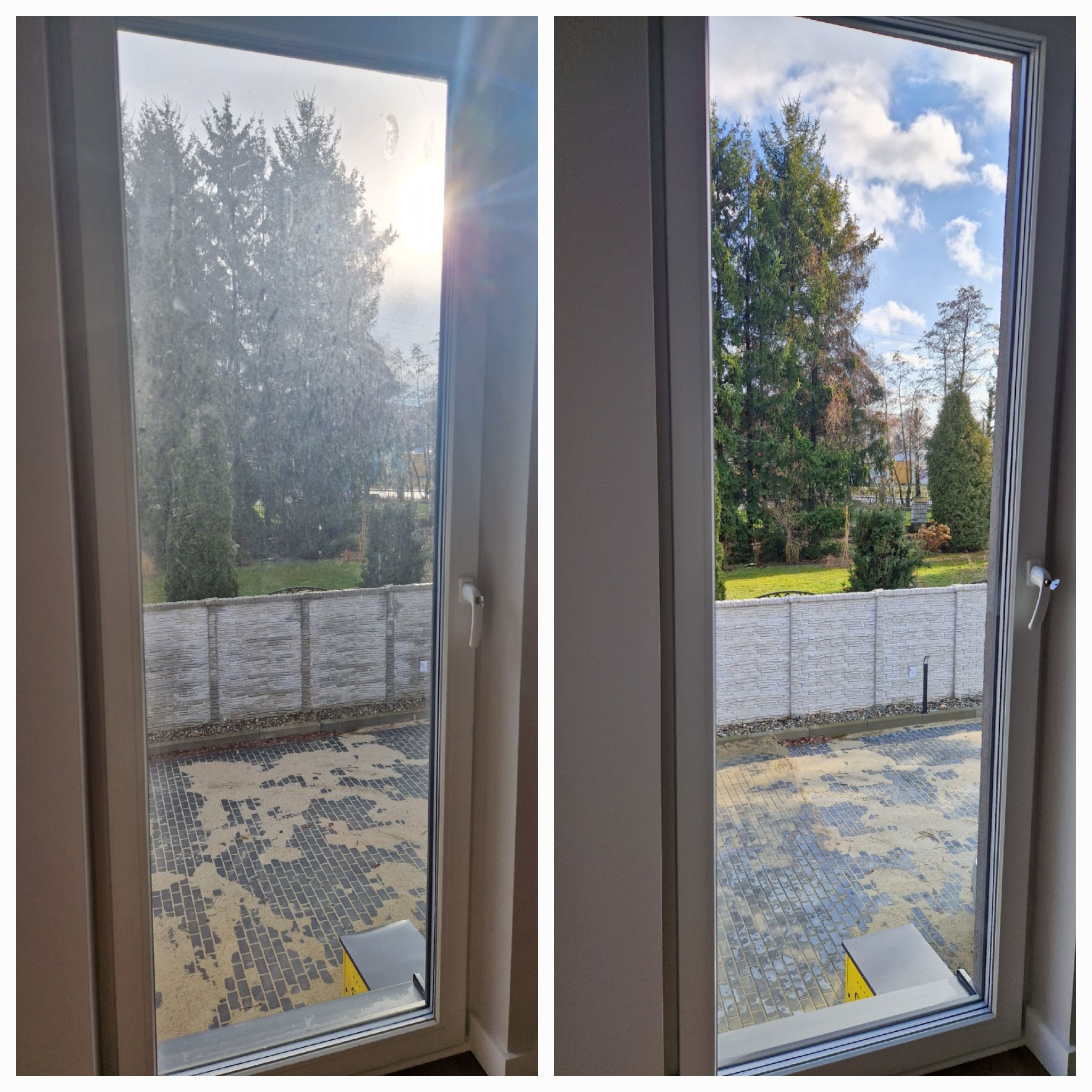 Okno dwudzielne, po lewej stronie brudne, po prawej czyste, widok na podwórko z kostki brukowej, ogrodzenie i drzewa.