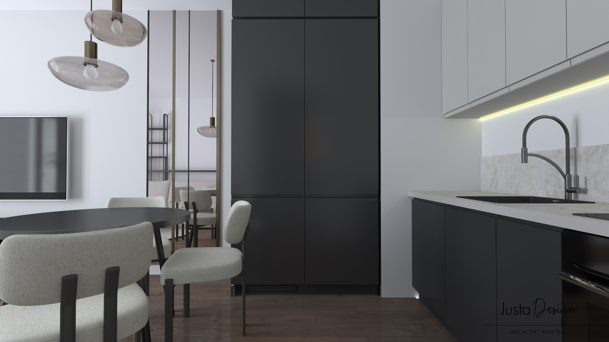 Minimalistyczna kuchnia z czarnymi szafkami, okrągłym stołem i krzesłami w odcieniach szarości, oświetlona wiszącymi lampami z mlecznego szkła, z widocznym logo projektanta wnętrz w rogu