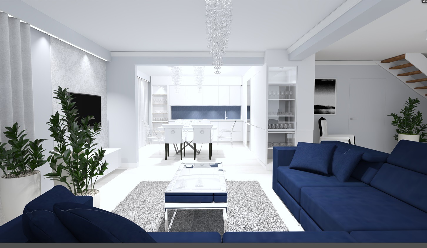 Wizualizacja wnętrza: salon z granatową sofą, stolikiem kawowym na dywanie, otwarta przestrzeń na jadalnię i kuchnię w bieli, kryształowy żyrandol, rośliny doniczkowe.