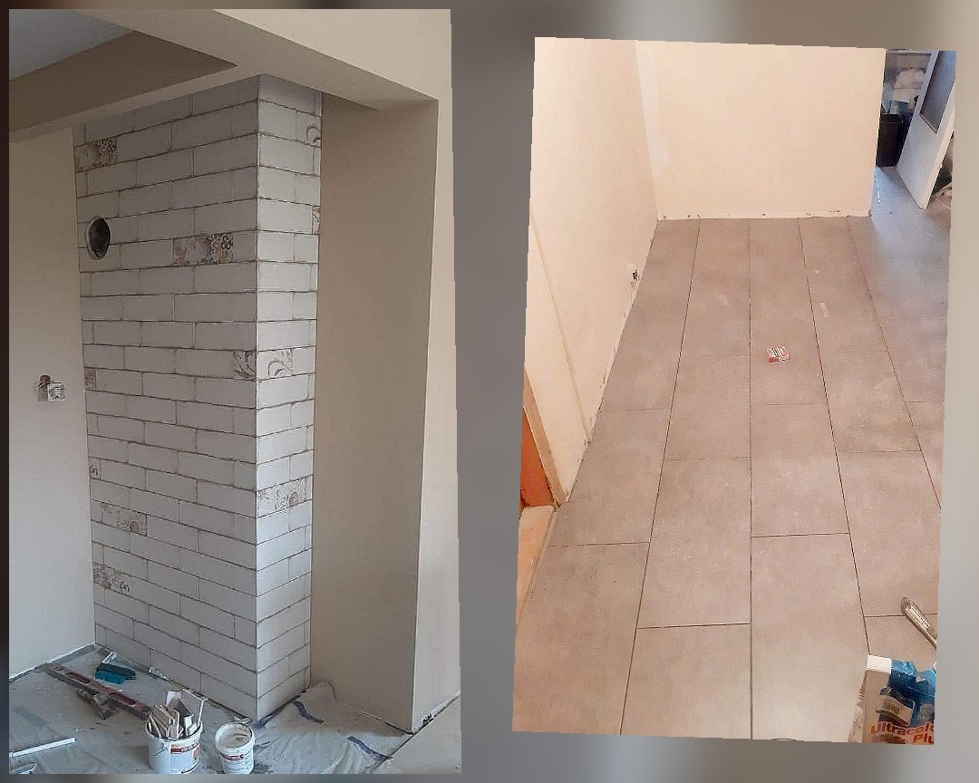 Fragment wykończonego wnętrza: kolumna obłożona białą cegłą z dekoracyjnymi wstawkami i otworem, widok na podłogę z szarych, prostokątnych płytek w trakcie układania, widoczne narzędzia i materiały...