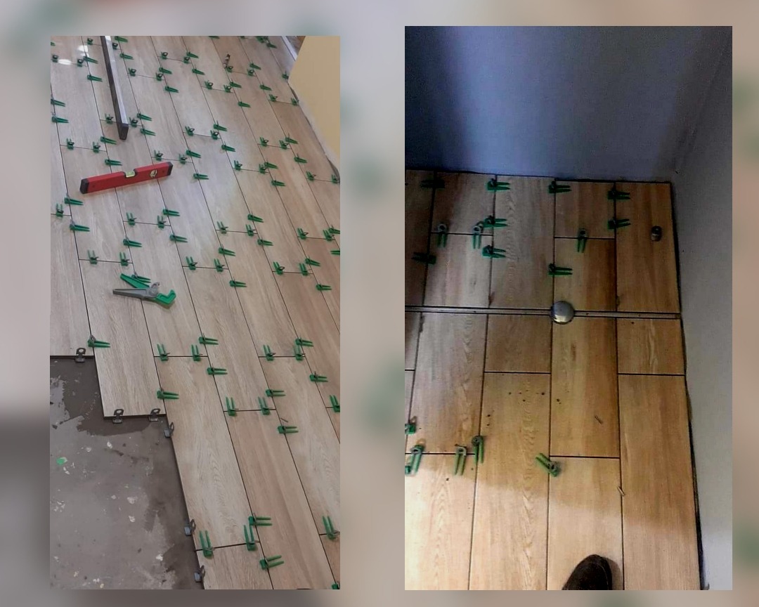 Układanie podłogowych paneli imitujących drewno z użyciem klipsów poziomujących i poziomicy; widoczny fragment nieukończonej powierzchni.