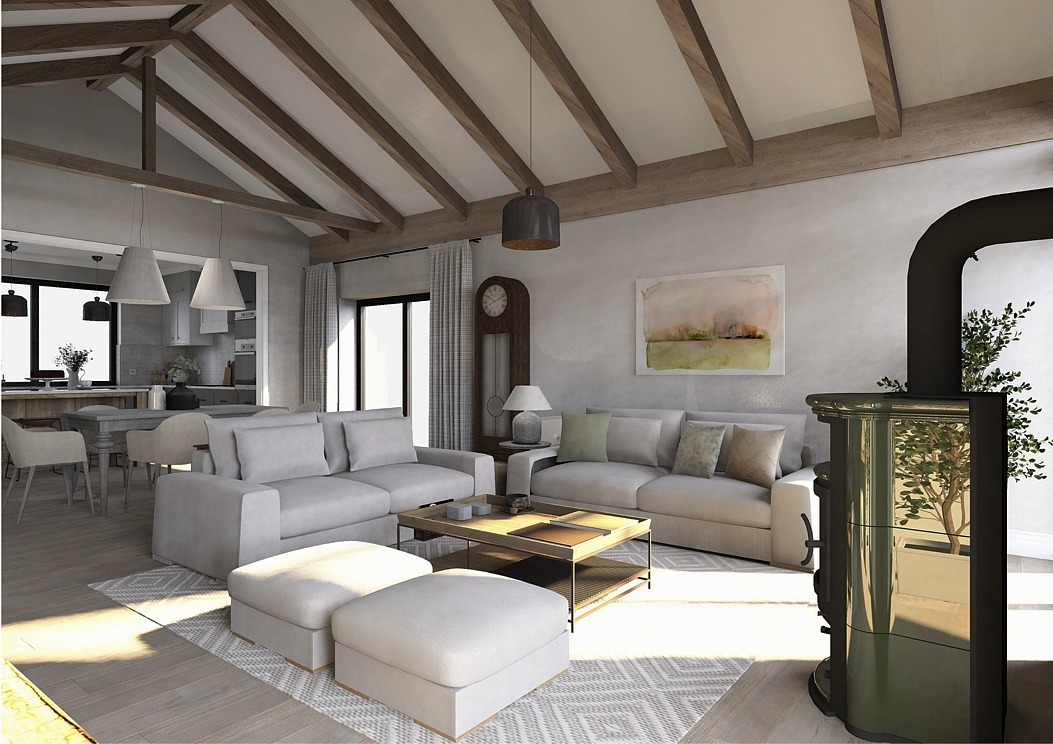 Jasny salon z drewnianymi belkami stropowymi, dwoma sofami, pufami, stolikiem kawowym i piecem kaflowym w rogu, widok na kuchnię w tle.