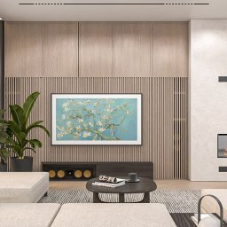 Whitehill Architecture Piotr Domanowski - Jasny salon z telewizorem prezentującym obraz kwitnącego drzewa, nowoczesnym kominkiem i roślinami doniczkowymi, ukazujący harmonię i styl aranżacji.