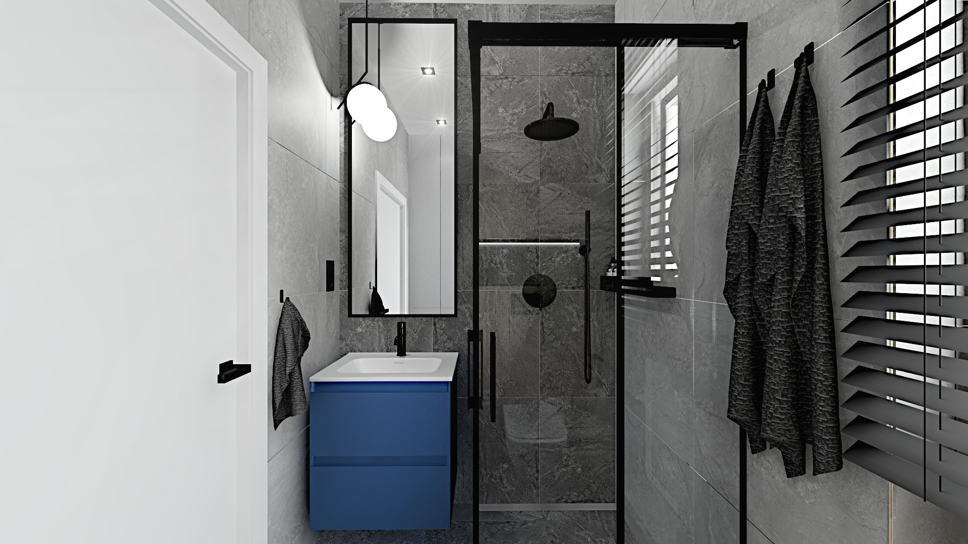 Nowoczesna łazienka z kabiną prysznicową typu walk-in, umywalką w szafce w kolorze granatowym, lustrem z oświetleniem punktowym i szarymi płytkami imitującymi kamień.