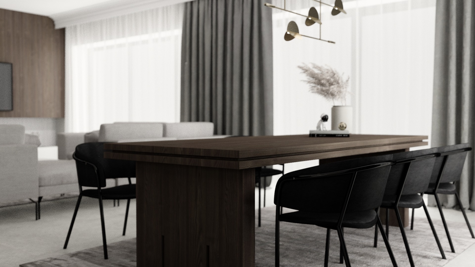 Nowoczesna jadalnia z ciemnym drewnianym stołem, czarnymi krzesłami i dekoracyjnym wazonem z pampasową trawą na tle jasnego salonu z szarą sofą i zasłonami.