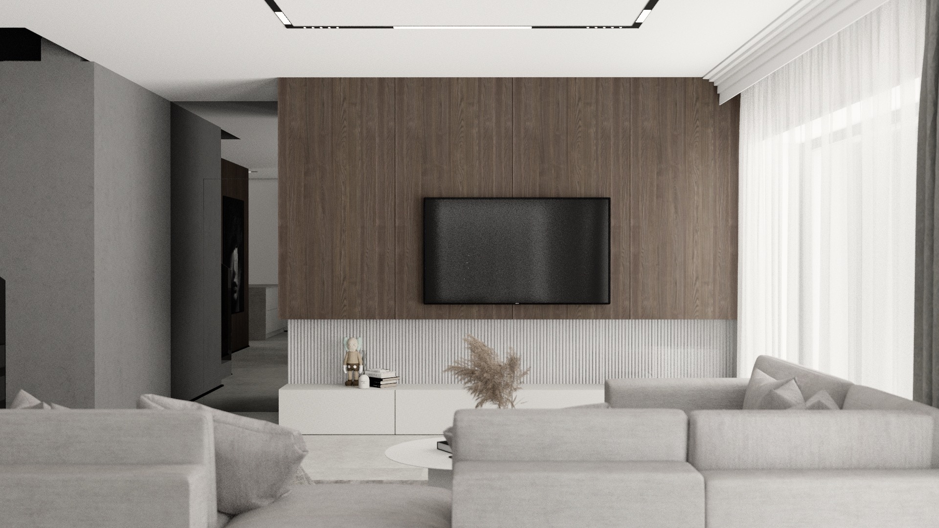 Minimalistyczny salon z drewnianą ścianą, telewizorem, białą szafką RTV, dekoracjami i szarą sofą modułową.
