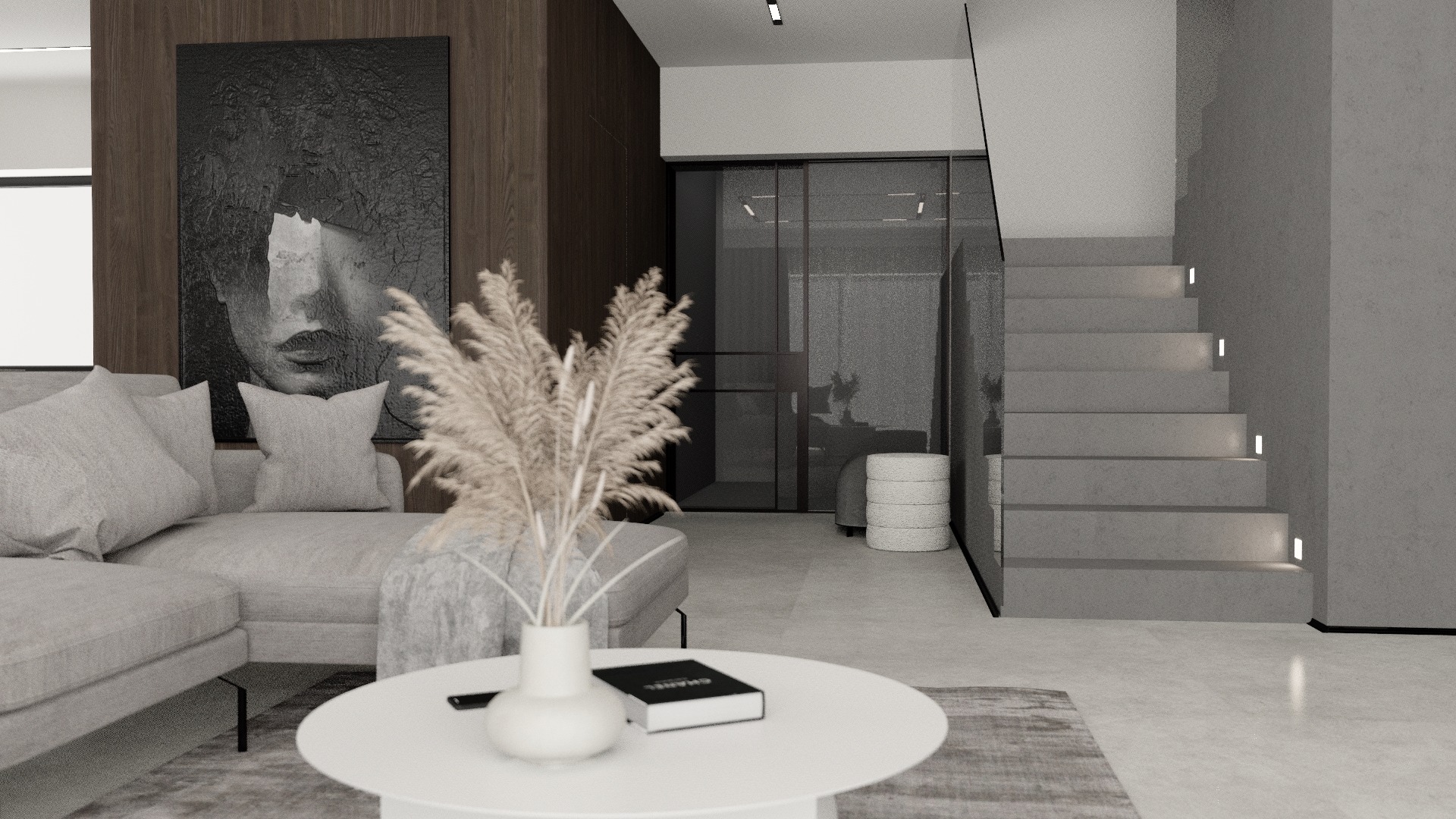 Minimalistyczny salon w Zielonej Górze z szarą sofą, okrągłym białym stolikiem kawowym z wazonem i książką, oraz schodami z podświetleniem LED, całość w stonowanej kolorystyce.