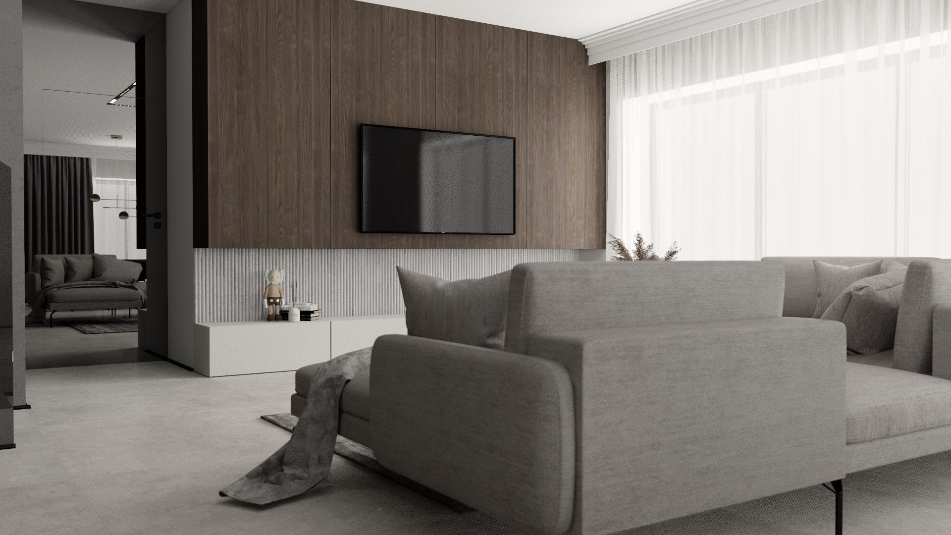 Nowoczesny salon z szarą sofą, drewnianą ścianą TV i dekoracyjną figurką na białej szafce RTV.