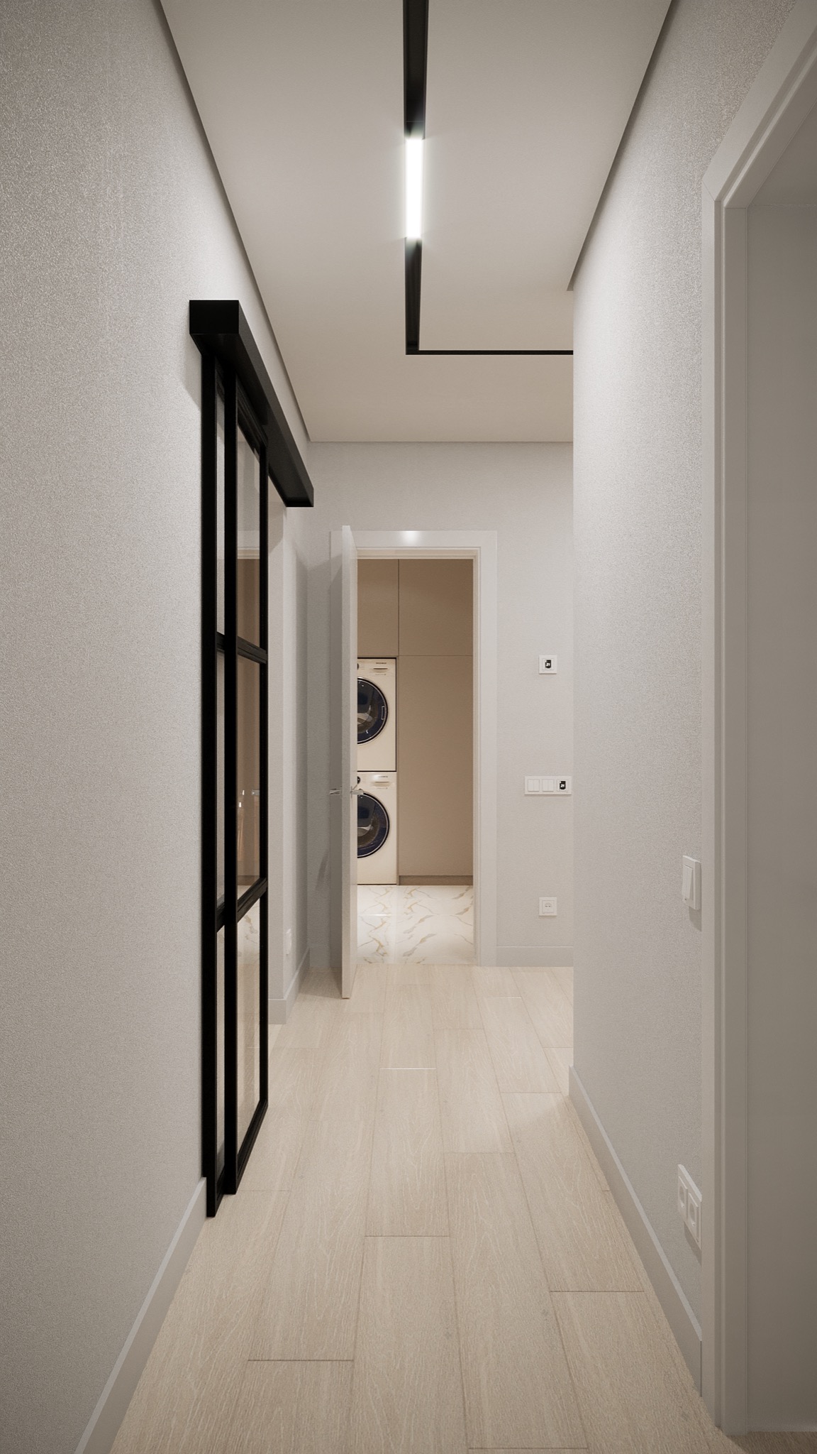 Wnętrze korytarza z widokiem na pralnię z pralką i suszarką w zabudowie, oświetlenie liniowe sufitowe, szklane drzwi przesuwne z czarną ramą.