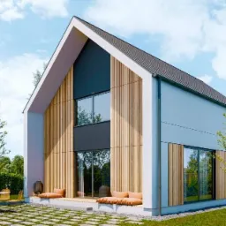 Wizualizacja nowoczesnego domu z drewnianą fasadą, dużymi oknami i tarasem z meblami ogrodowymi, otoczonego zielenią i błękitnym niebem.