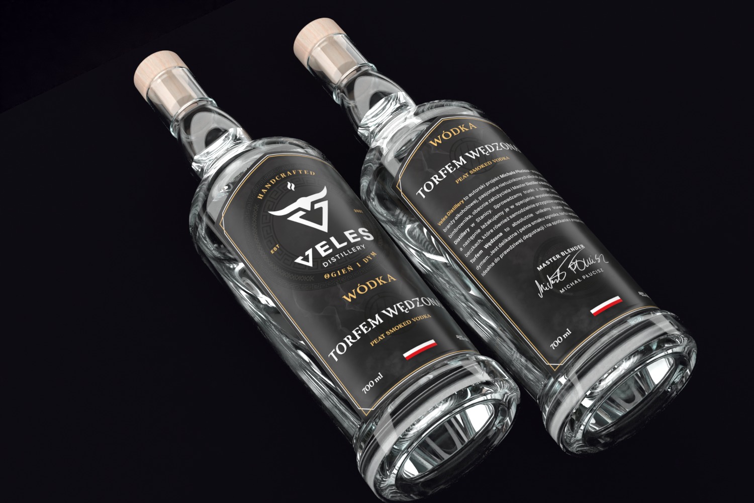 Dwie butelki wódki Torfem Wędzon na czarnym tle, z etykietami w kolorze czarnym i złotym, prezentujące markę Veles Distillery.