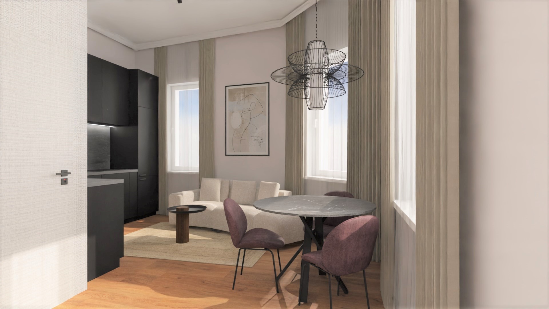 Wnętrze mieszkania z otwartą kuchnią, jadalnią i salonem. Czarna zabudowa kuchenna, okrągły stół z krzesłami w odcieniach fioletu, beżowa sofa i nowoczesna lampa wisząca.