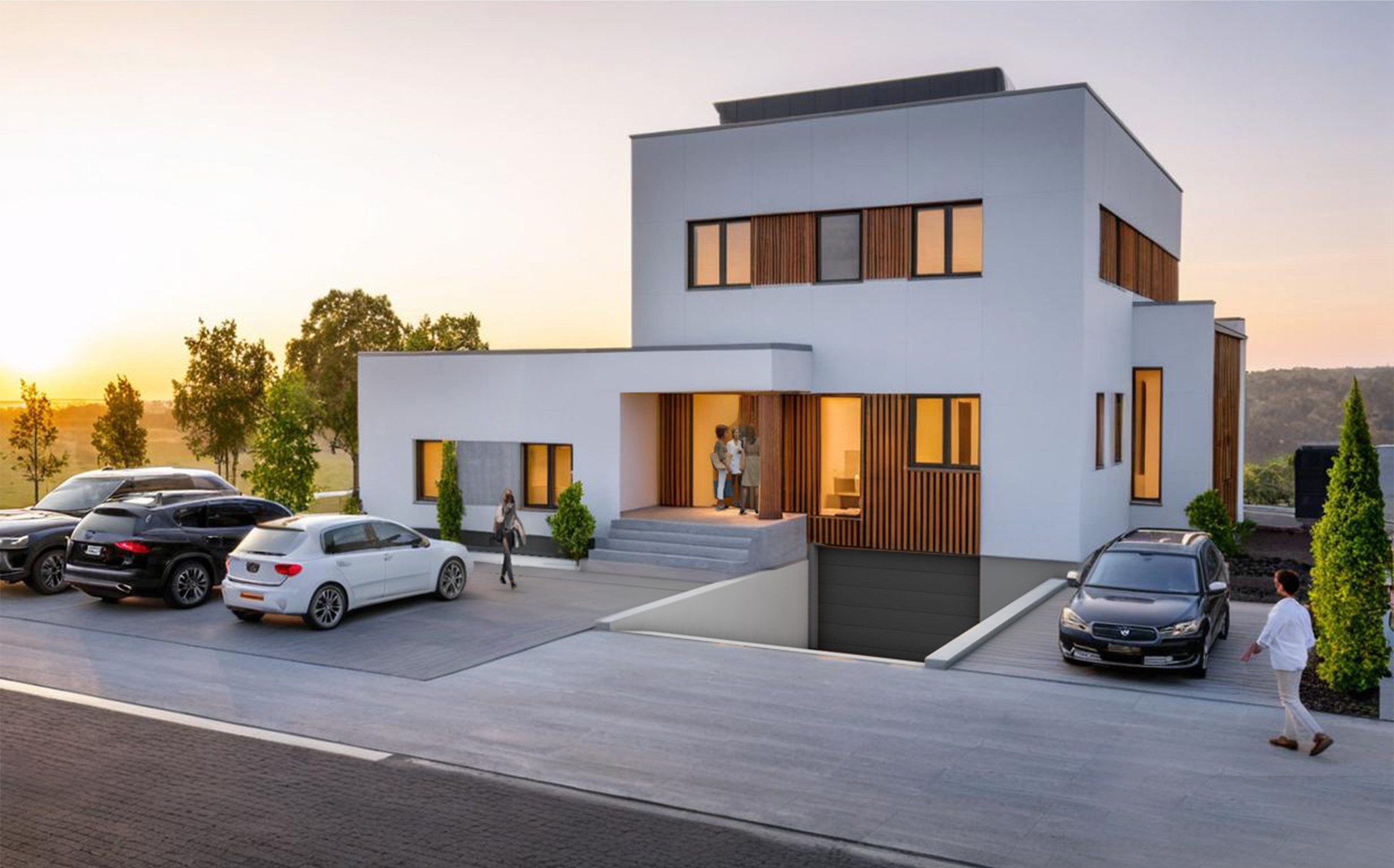 Nowoczesny dom z garażem podziemnym, biała elewacja z drewnianymi akcentami, kilka samochodów na podjeździe, osoby wchodzące do domu, ciepłe światło zachodzącego słońca.