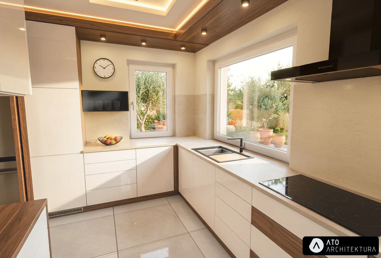 Nowoczesna kuchnia z białymi szafkami, drewnianymi akcentami i dużymi oknami z widokiem na zieleń. Na blacie misa z owocami i czarna płyta indukcyjna.