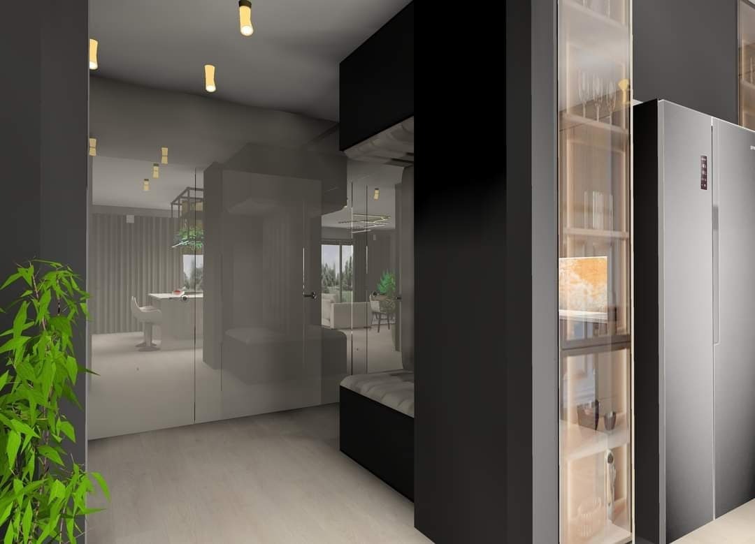 Nowoczesne wnętrze mieszkania z minimalistycznym designem, szklane ściany działowe, czarne meble, oświetlenie punktowe i widok na salon z kuchnią w tle.