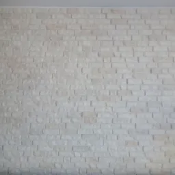 Ściana wyłożona białymi panelami imitującymi cegłę, z widoczną fakturą i nieregularnym ułożeniem.