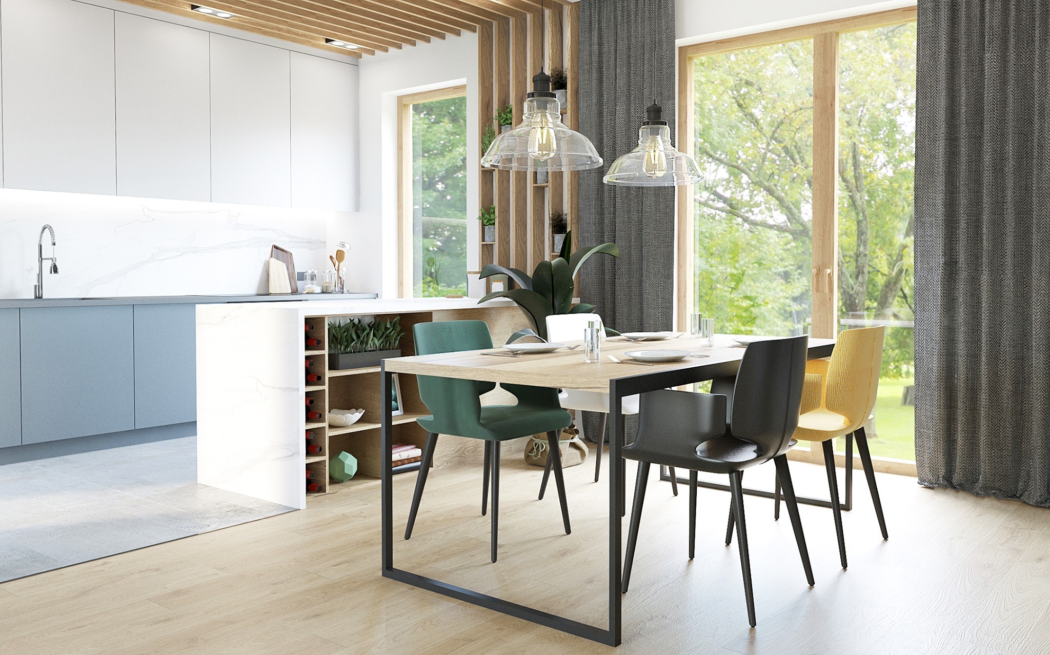 Jasna kuchnia z wyspą i stołem jadalnym, zielone krzesła, okna z widokiem na zieleń, lampy wiszące w stylu industrialnym, drewniane akcenty na suficie i ścianie.