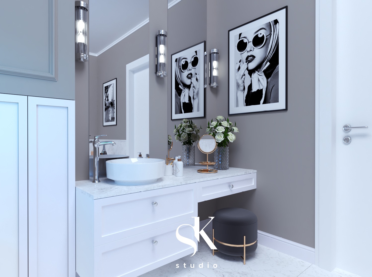 Wizualizacja łazienki z białą umywalką nablatową, marmurowym blatem, białymi szafkami z szufladami, okrągłym pufem i dekoracyjnymi obrazami w czarnych ramach.