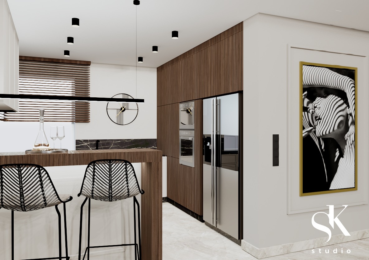 Wizualizacja nowoczesnej kuchni z wyspą, hokerami z plecionki, drewnianymi frontami, marmurowym blatem, czarnym zegarem na ścianie i abstrakcyjnym obrazem w złotej ramie.