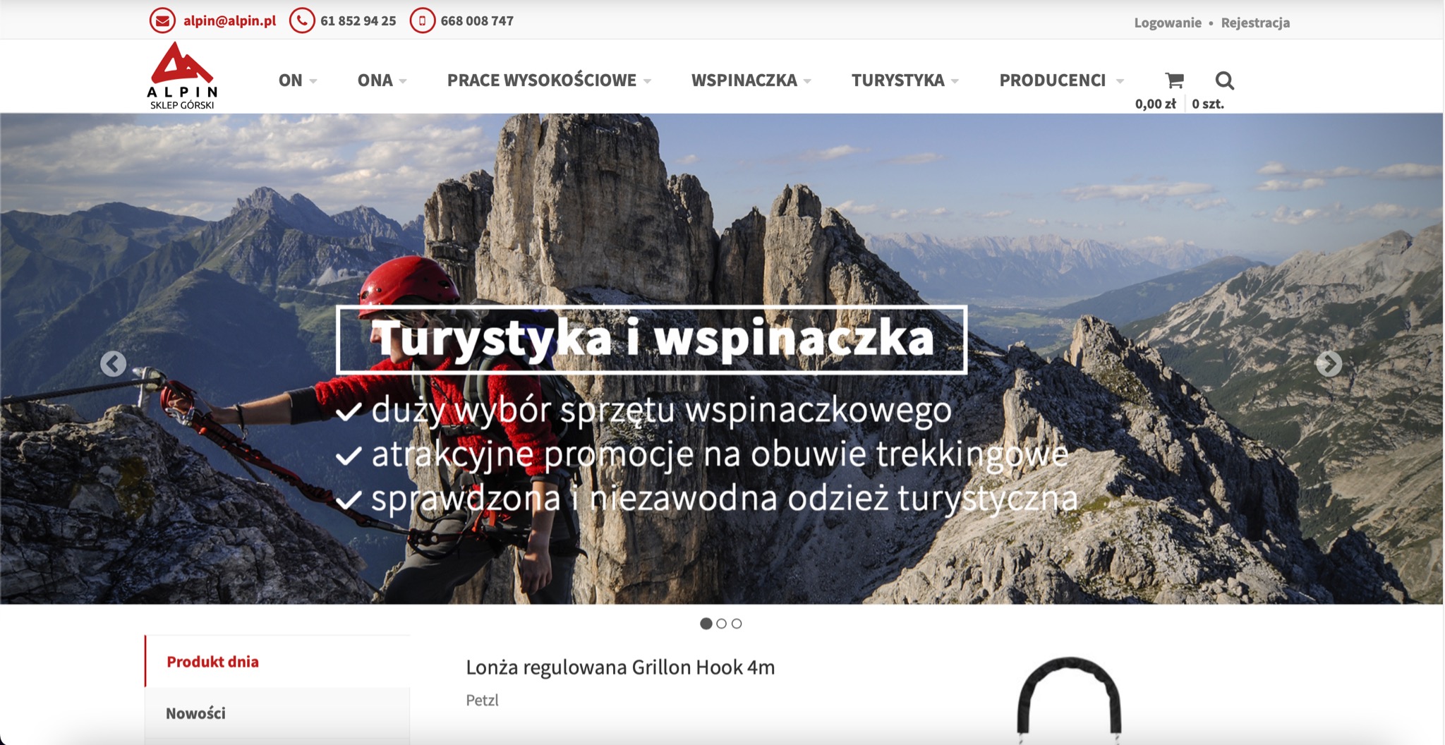 Osoba w czerwonym kasku zabezpieczona liną na skalistym szczycie z widokiem na góry w tle, promująca turystykę i wspinaczkę.