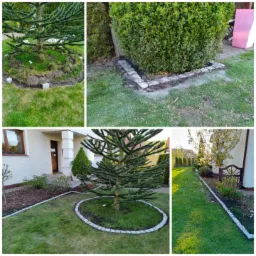 Aranżacja ogrodu z obrzeżami z kostki granitowej wokół drzew i rabat, widok na trawnik i dom.