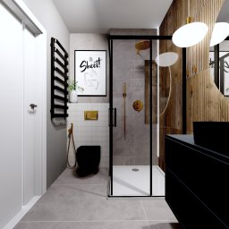 Cozy Studio - Nowoczesna łazienka z czarną armaturą, kabiną prysznicową typu walk-in i drewnianymi panelami dekoracyjnymi. Minimalistyczny design z akcentami złota.