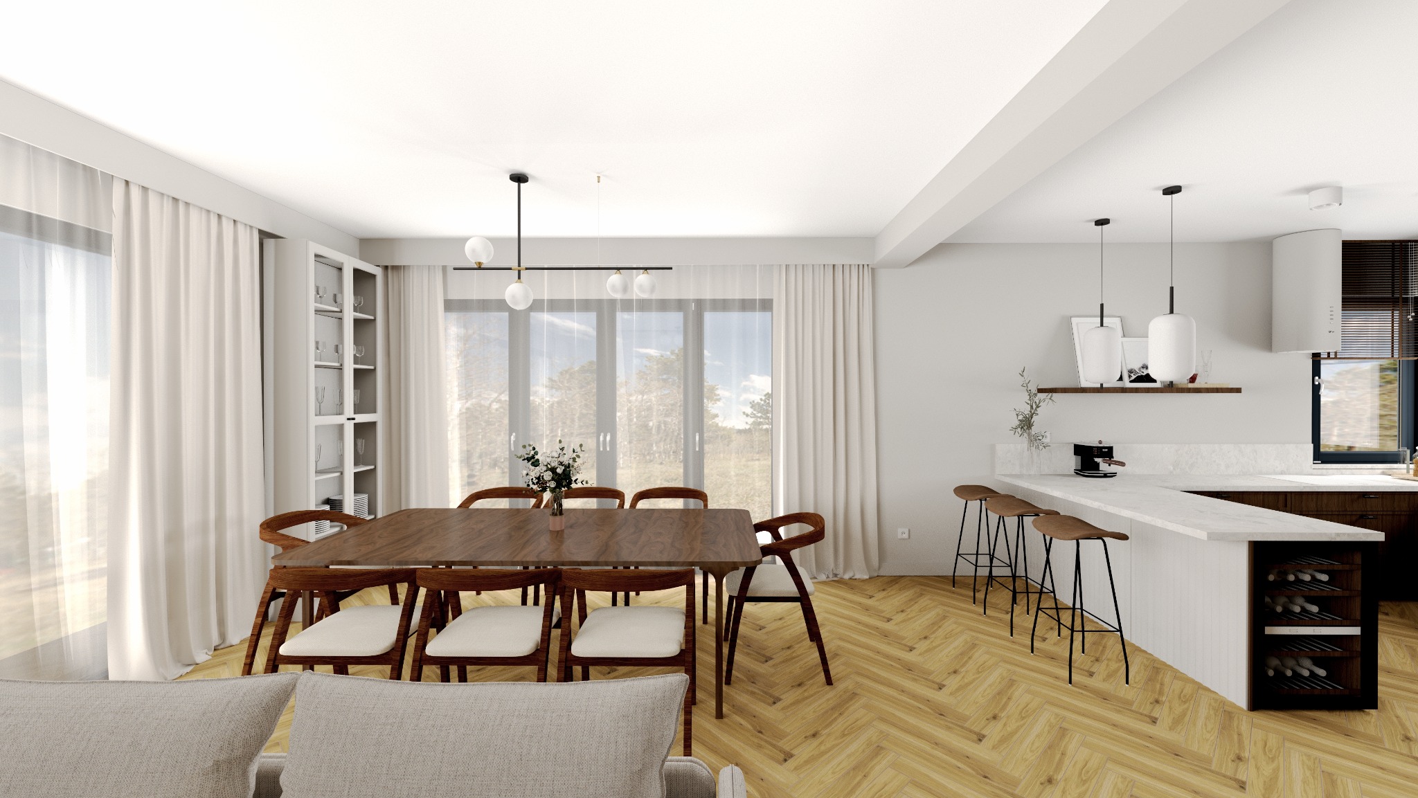 Jasne wnętrze z drewnianym stołem i krzesłami, widok na kuchnię z barkiem. Parkiet w jodełkę, duże okna z białymi zasłonami. Minimalistyczny design.