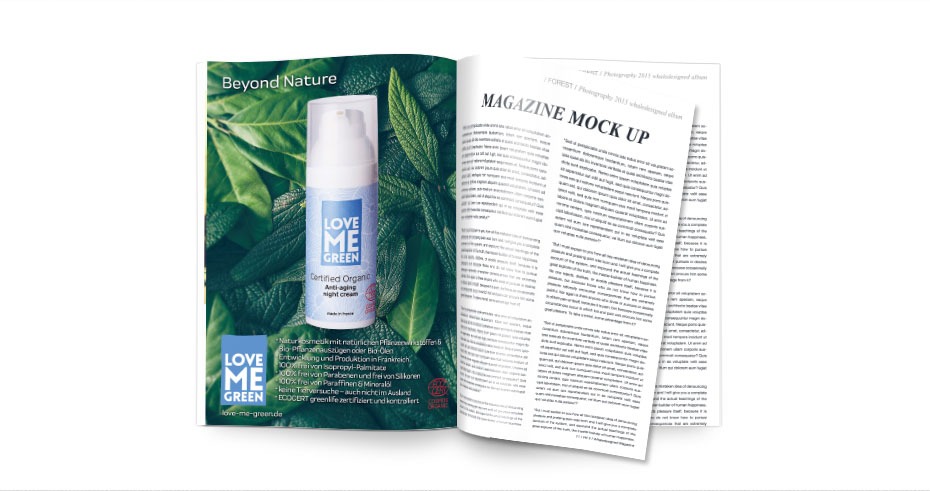 Otwarta gazeta z reklamą kremu do twarzy Love Me Green na tle zielonych liści, obok artykuł w języku angielskim.