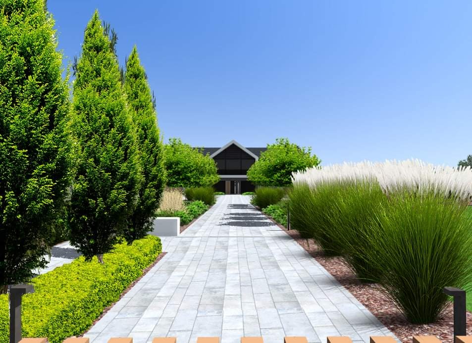 Projekt ogrodu z alejką z jasnej kostki prowadzącą do nowoczesnego domu, wysokie tuje po lewej stronie, ozdobne trawy po prawej, oświetlenie wzdłuż ścieżki.