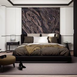 Delikatna ale konkretna sypialnia w ciemnych barwach. Piękne kamienne wezgłowie z oryginalnym wzorem idealnie komponuje się z łóżkiem i tworzy jedność.