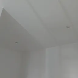 Dwa okrągłe punkty świetlne, prawdopodobnie halogenowe lub LED, zamontowane w białym suficie pod kątem.