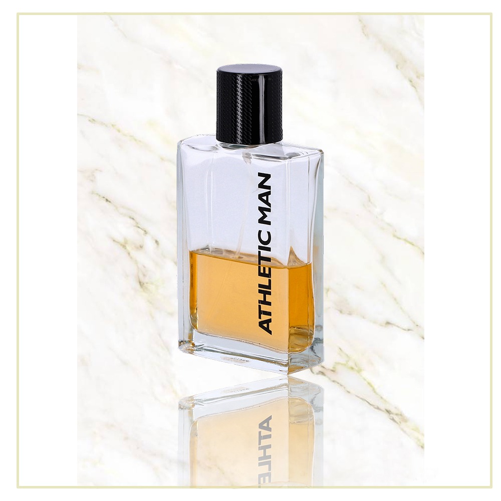 Flakon męskiej wody toaletowej Athletic Man z czarnym korkiem, ustawiony na marmurowym tle, widoczne odbicie.