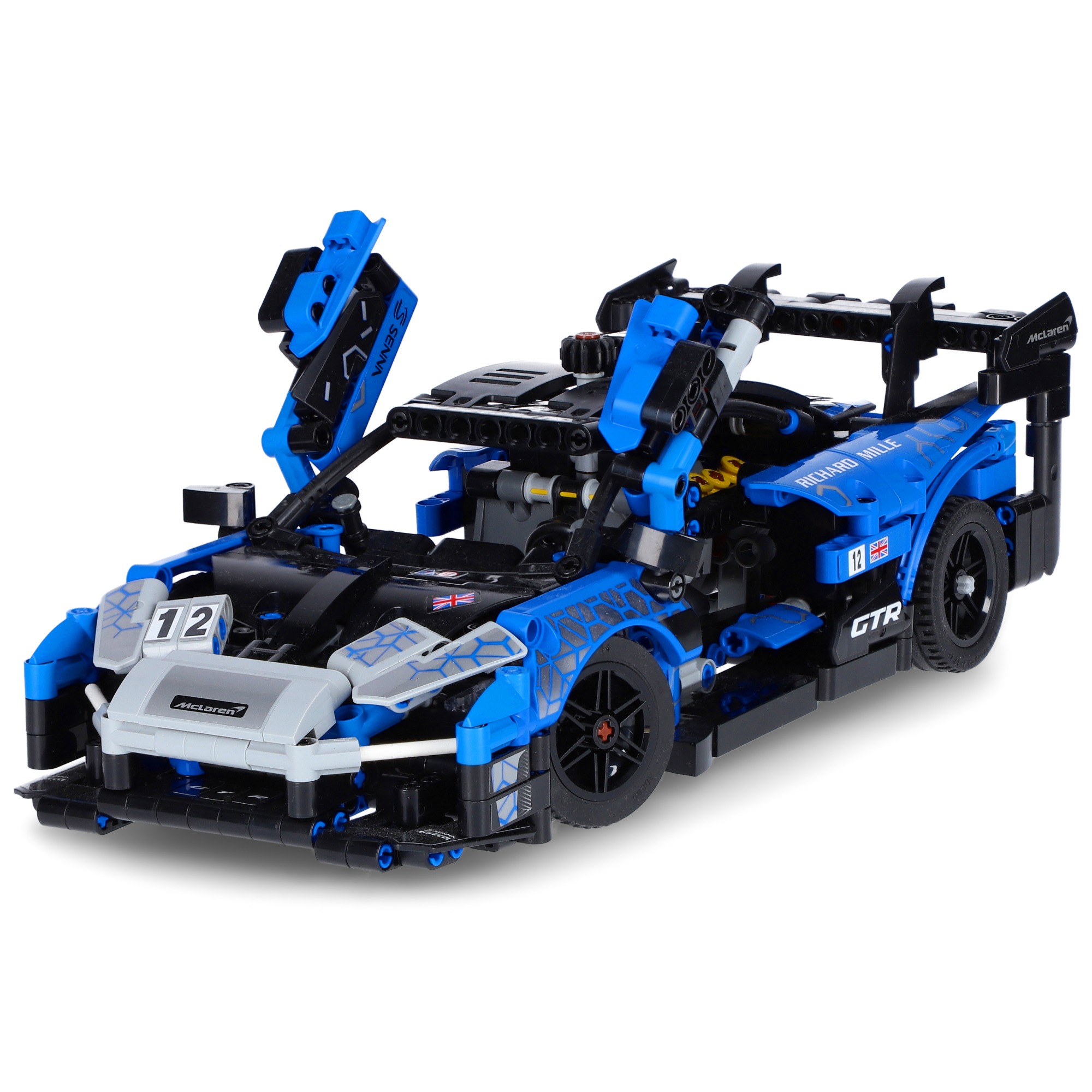 Model samochodu McLaren Senna GTR zbudowany z klocków, w kolorze niebiesko-czarnym, z otwartymi drzwiami i widocznymi detalami konstrukcyjnymi.