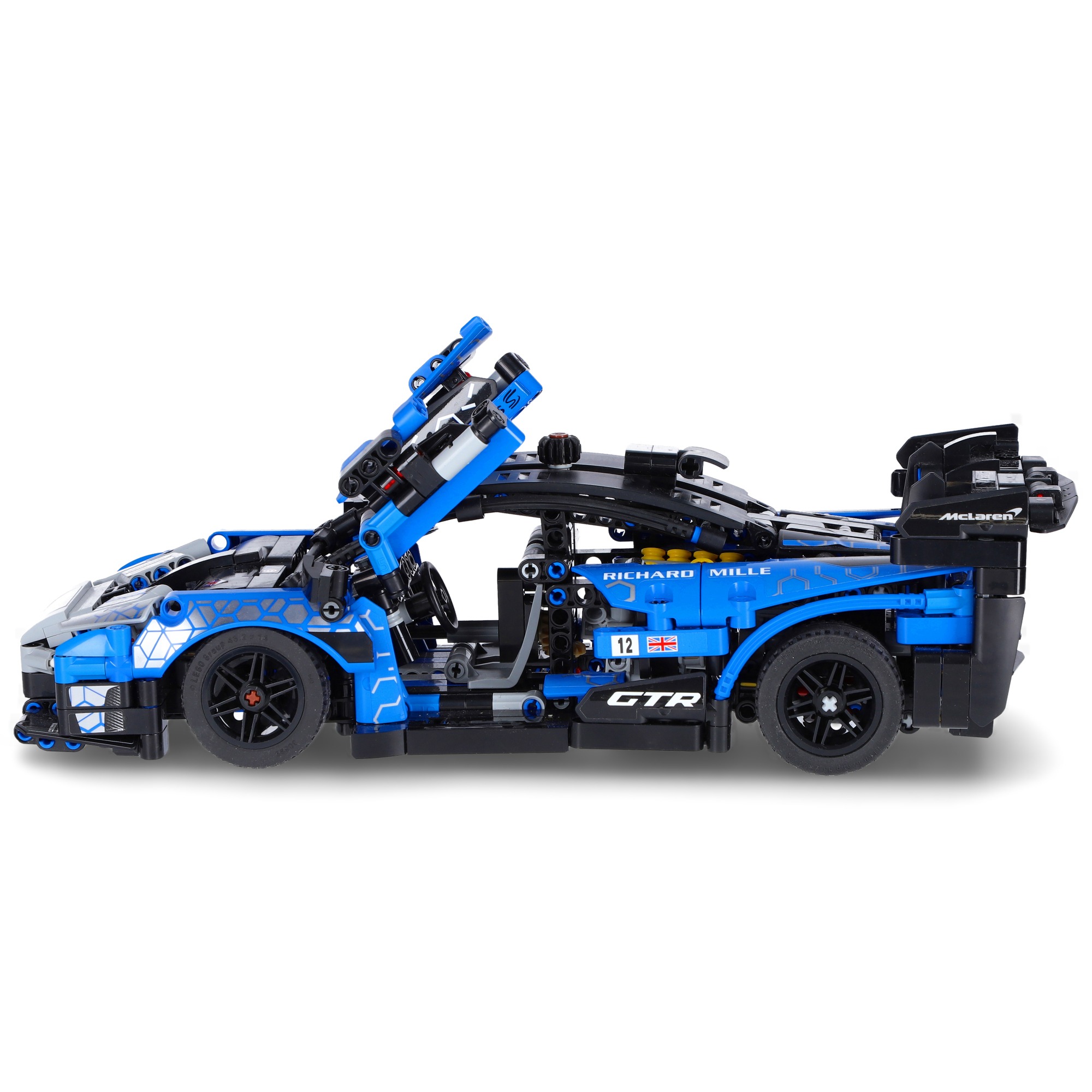 Niebieski model samochodu McLaren GTR z klocków Lego Technic, z otwartymi drzwiami, widoczne detale konstrukcyjne i naklejki z logo.