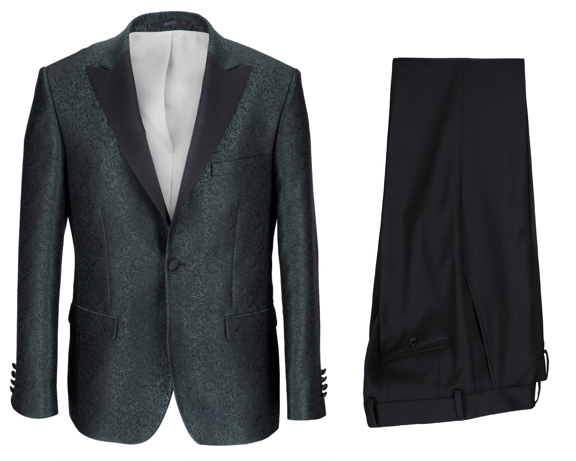 Elegancki, zielony smoking z czarnymi klapami i białą koszulą, obok leżą czarne spodnie.