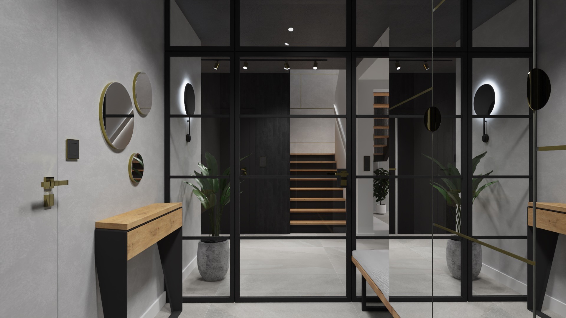 Nowoczesny przedpokój z szarą ścianą, drewnianą konsolą, okrągłymi lustrami w złotych ramkach i przeszkloną ścianą działową z czarnymi szprosami, za którą widać schody.