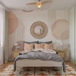 Jasna sypialnia z łóżkiem, szafkami nocnymi i okrągłym lustrem. Na ścianie geometryczne wzory w odcieniach beżu i brązu. Nad łóżkiem dekoracyjna lampa. Minimalistyczny styl.
