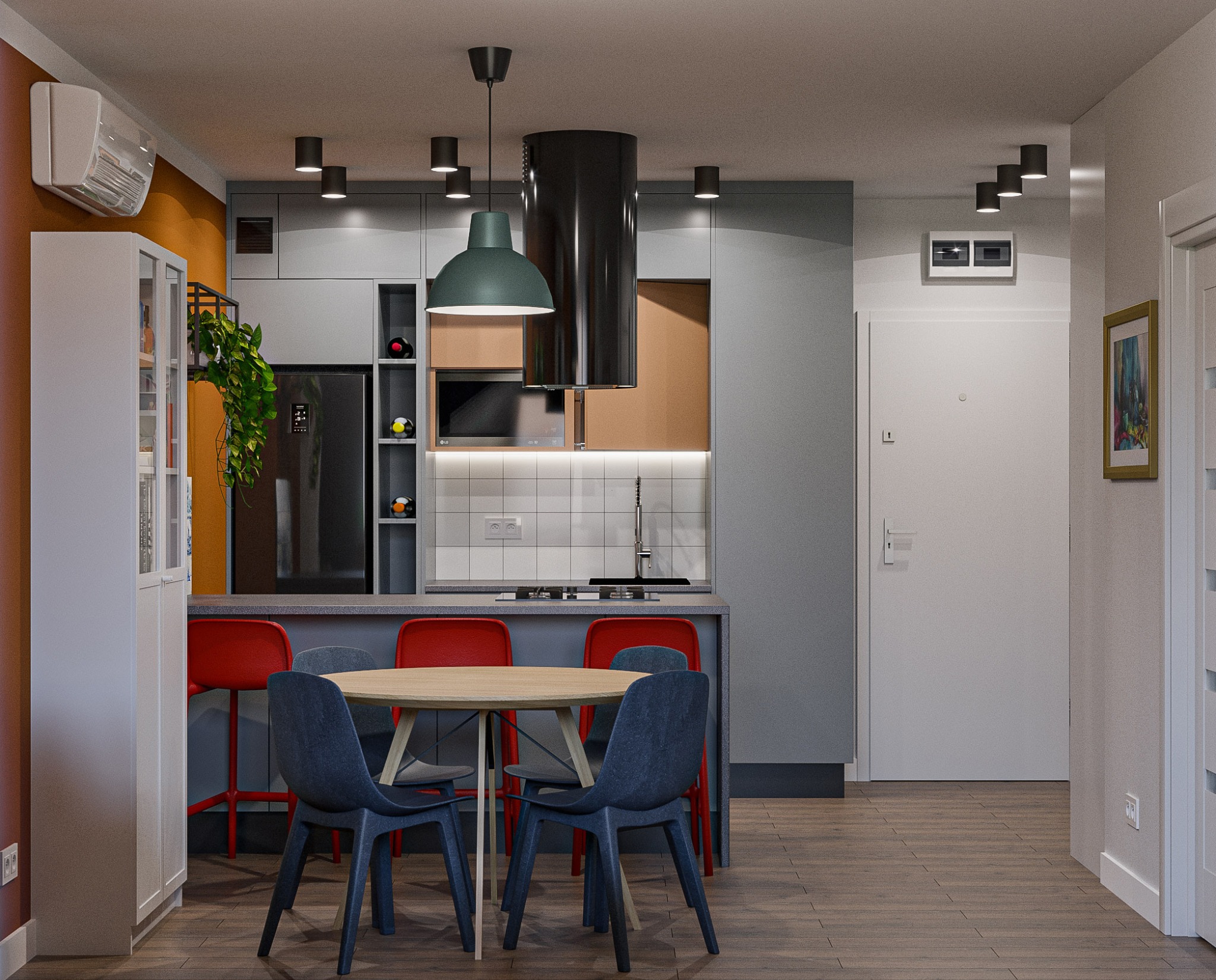 Nowoczesna aranżacja kuchni z jadalnią: szare szafki, okrągły stół z krzesłami, czarny okap i akcenty kolorystyczne pomarańczu i czerwieni. Minimalistyczny design.